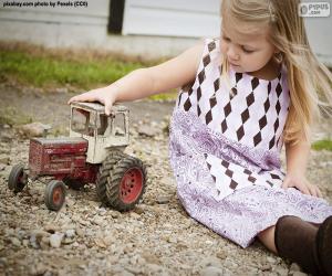 Puzzle Fille jouant avec un tracteur