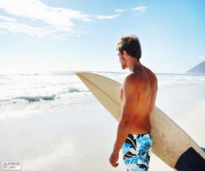 Puzzle Homme avec une planche de surf