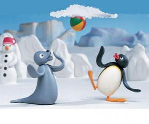 Puzzle Pingu et Robby le phoque en jouant avec le traîneau