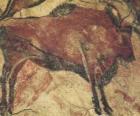 Peinture rupestre en représentant un buffle dans la paroi d'une grotte