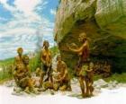 Groupe d'hommes de Neanderthal sous la protection d'une abri sous roche, les individus en effectuant différentes activités: quelques en taillant des pierres, d'autres en préparant la chasse
