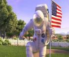 Le capitaine Charles Chuck Baker, martelant le drapeau américain à atterrir sur la Planet 51