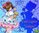 Sakura, la capteuse des cartes avec une de ses robes à côté de Kero