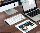 Image avec plusieurs produits d’Apple, un iMac, un MacBook et un iPad