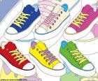 Six chaussures de sport de différentes couleurs, une chaussures utilisées par les jeunes