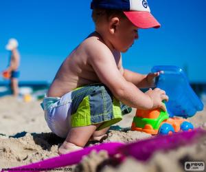 Puzzle Un enfant qui joue sur la plage